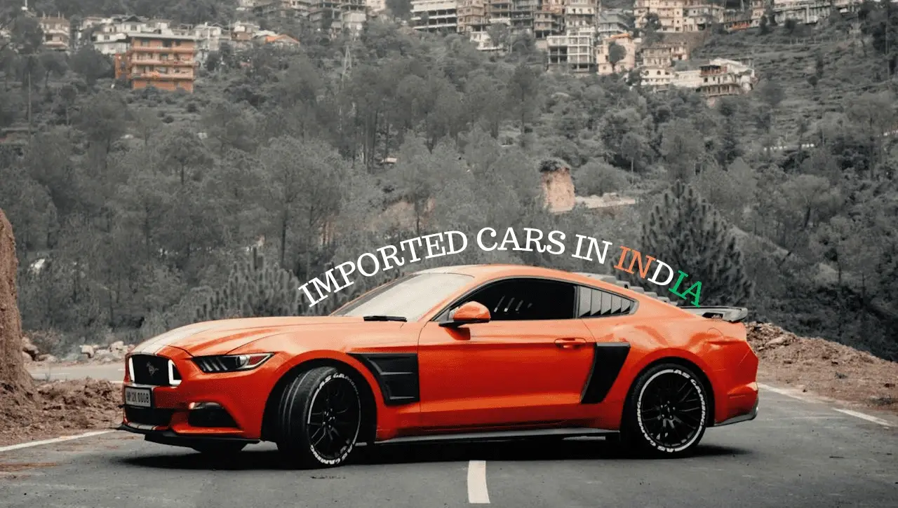 Orange Ford Mustang sports car on mountain road demonstrating how to import USA cars in India with Daytona Exotics