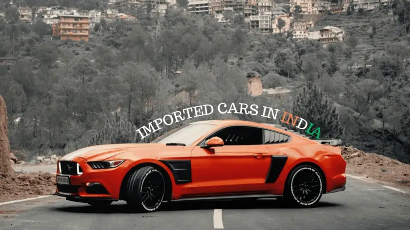 Orange Ford Mustang sports car on mountain road demonstrating how to import USA cars in India with Daytona Exotics