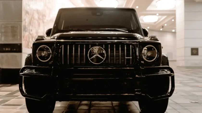 Black Mercedes-AMG G-Wagon luxury SUV front view in showroom from imported cars lineup at Daytona Exotics