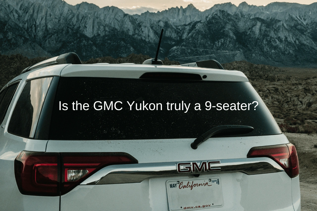 White GMC Yukon SUV parked with mountain landscape showcasing 9-seater capacity