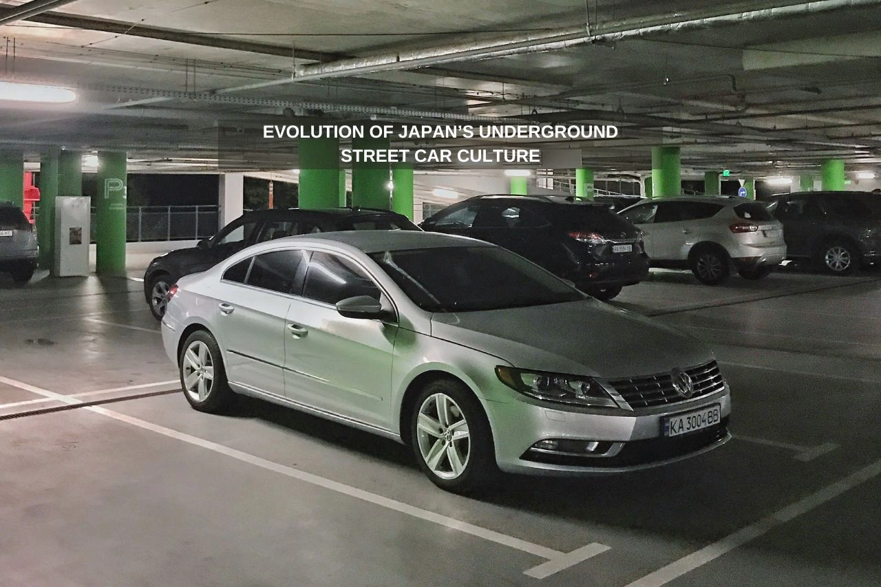 Silver sedan in underground parking garage representing Japan's street car culture evolution