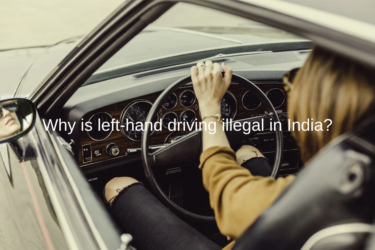 Person driving a left-hand drive muscle car interior with vintage dashboard exploring driving regulations in India