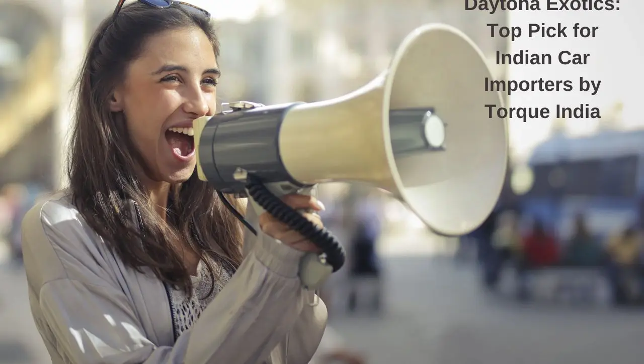 Woman announcing with megaphone about Daytona Exotics recognition as top car importer by Torque India