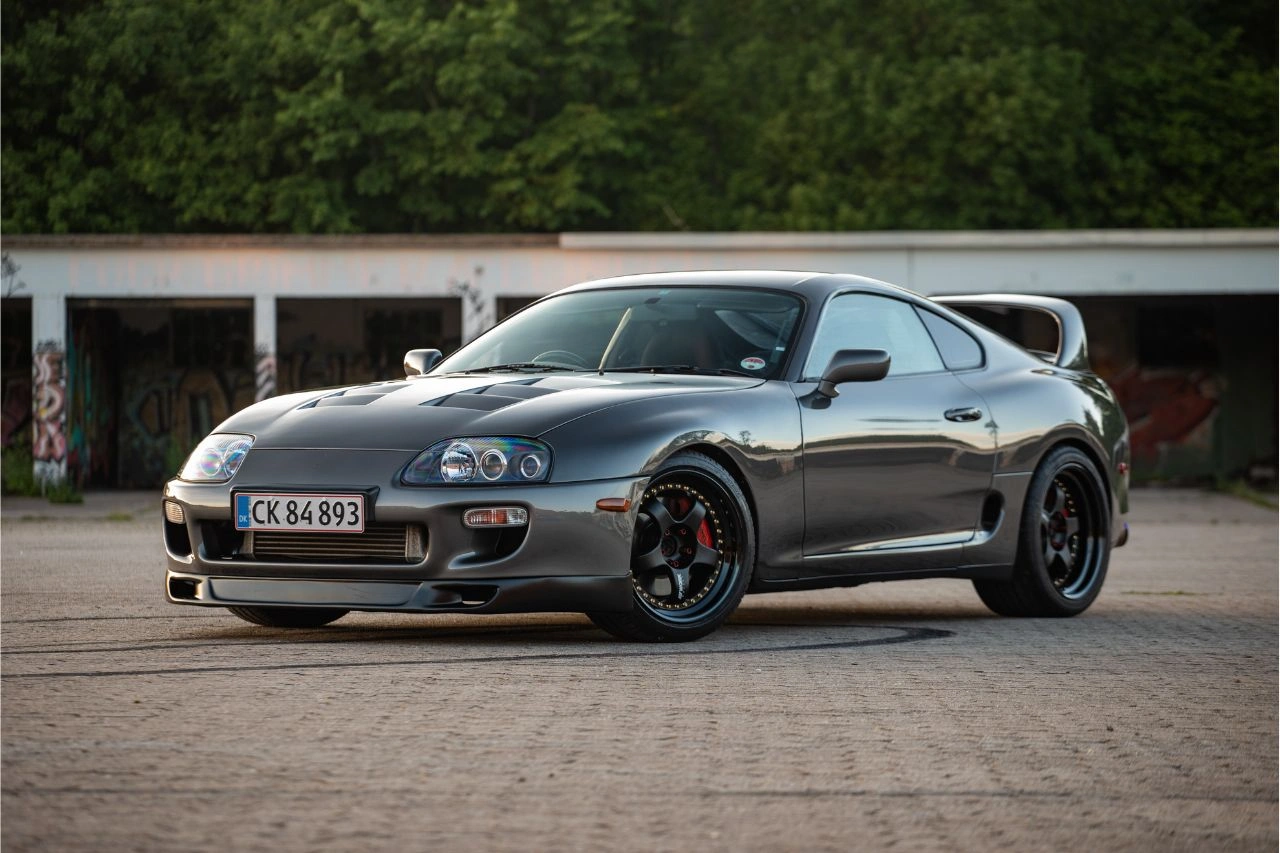 Silver Toyota Supra Japanese sports car parked outside garage exploring import of Japanese cars to India