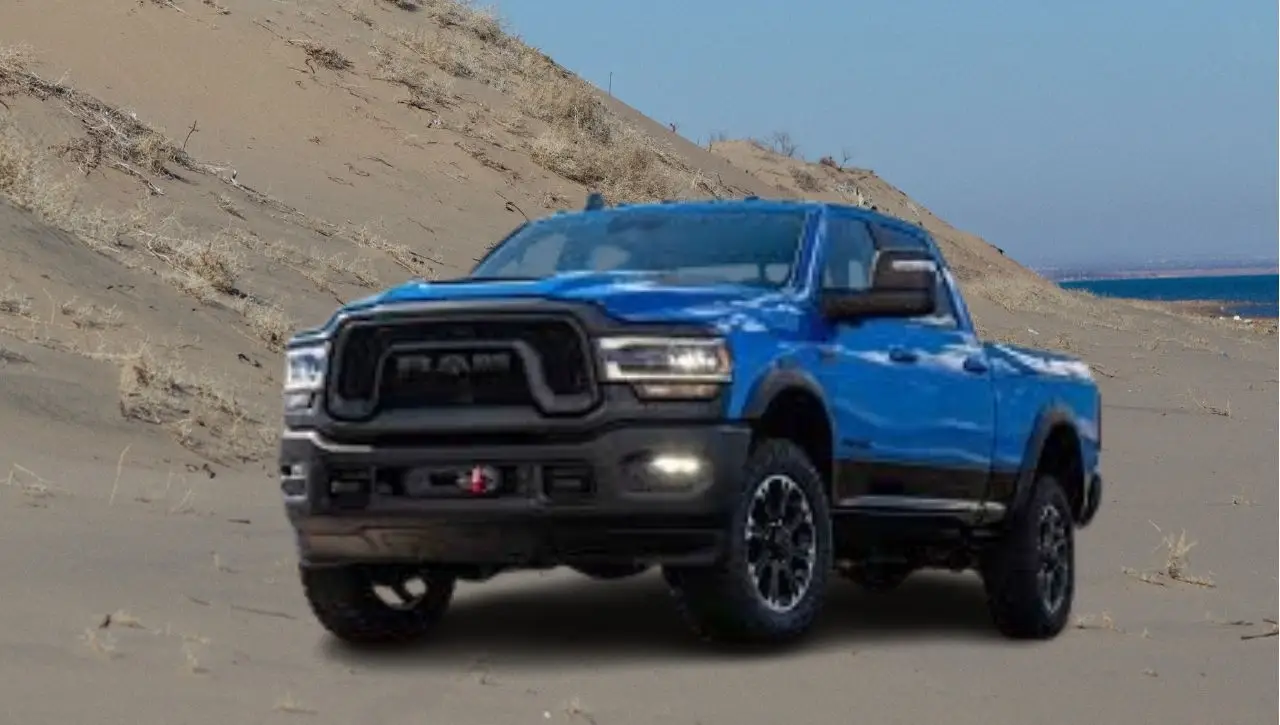Blue RAM 2500 HD Rebel off-road pickup truck in desert terrain showcasing ultimate off-road beast capabilities