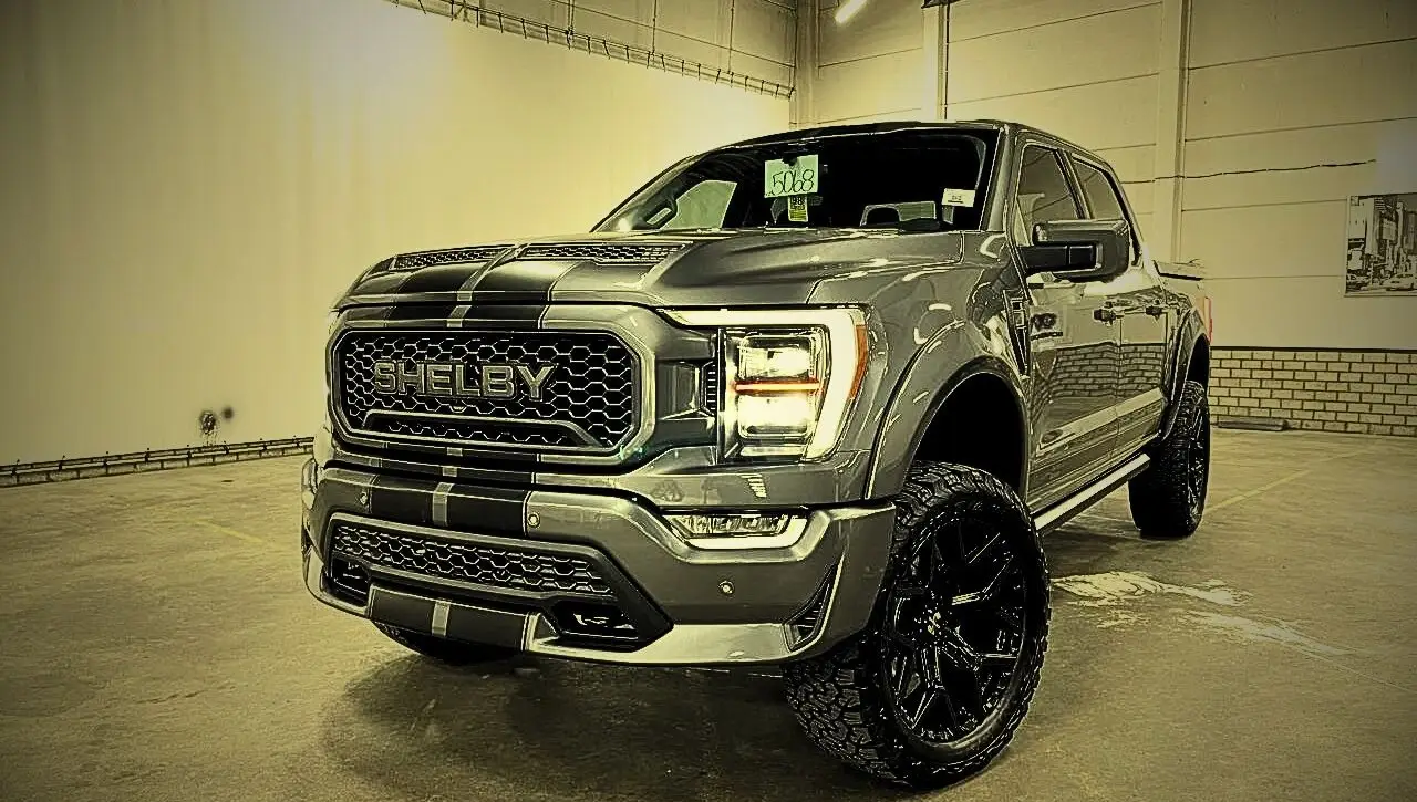 Shelby custom pickup truck in warehouse representing ultimate symbol of American muscle and performance