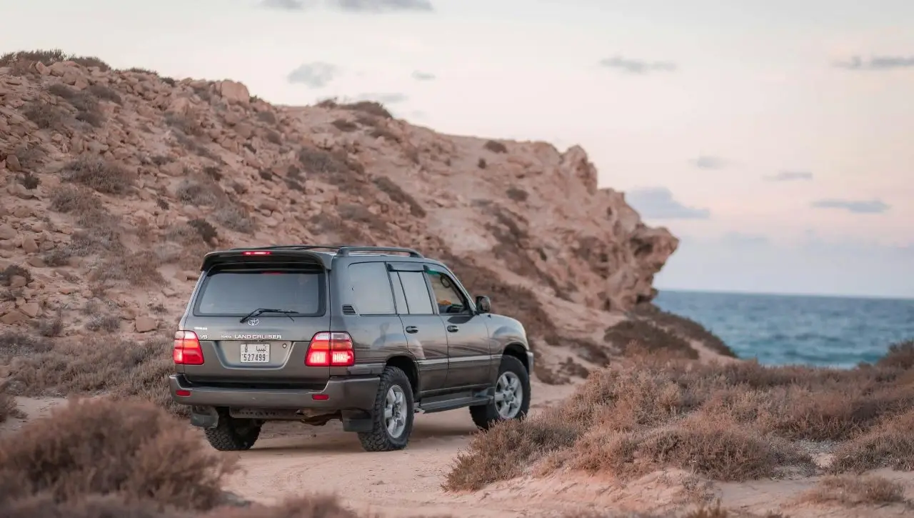 Toyota Land Cruiser on rocky coastal terrain exploring if this legendary SUV will finally roam Indian roads