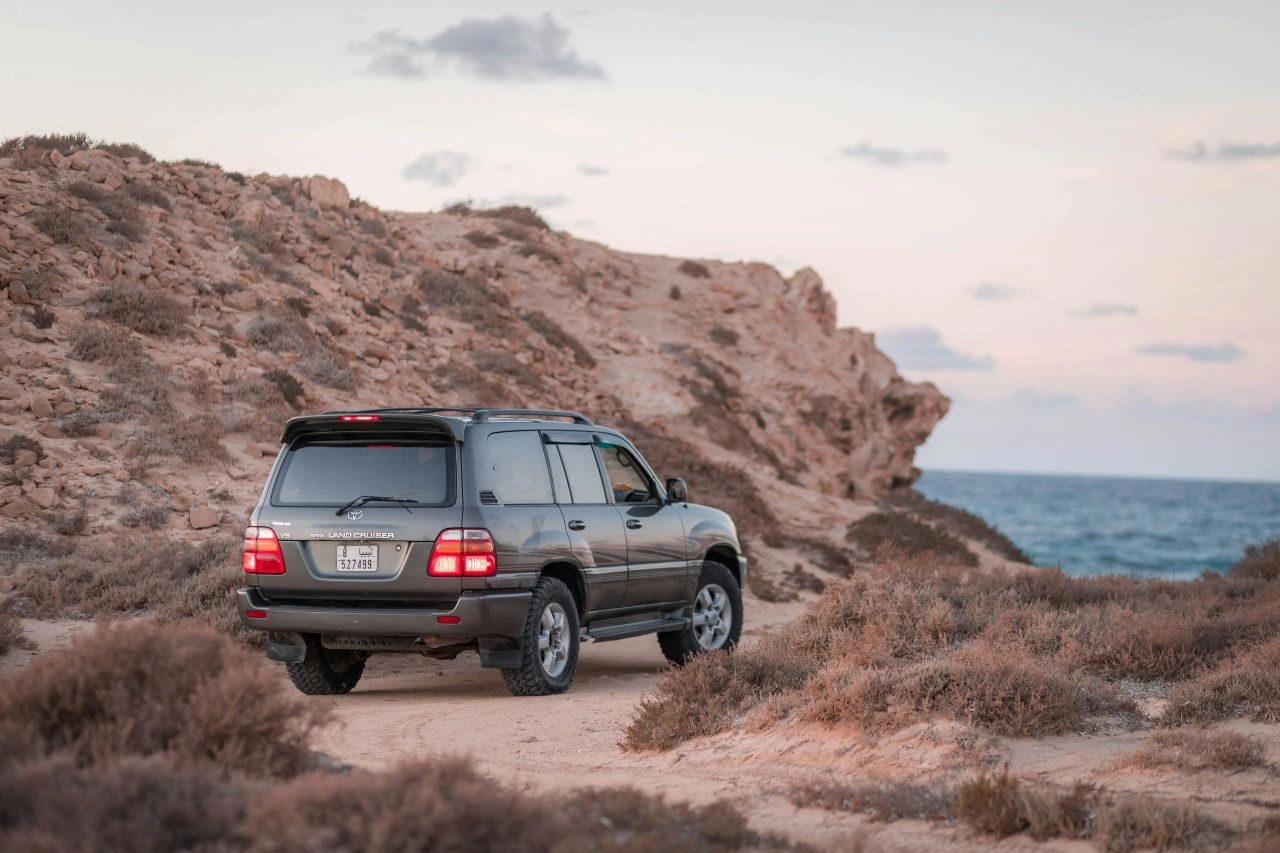 Toyota Land Cruiser on rocky coastal terrain exploring if this legendary SUV will finally roam Indian roads