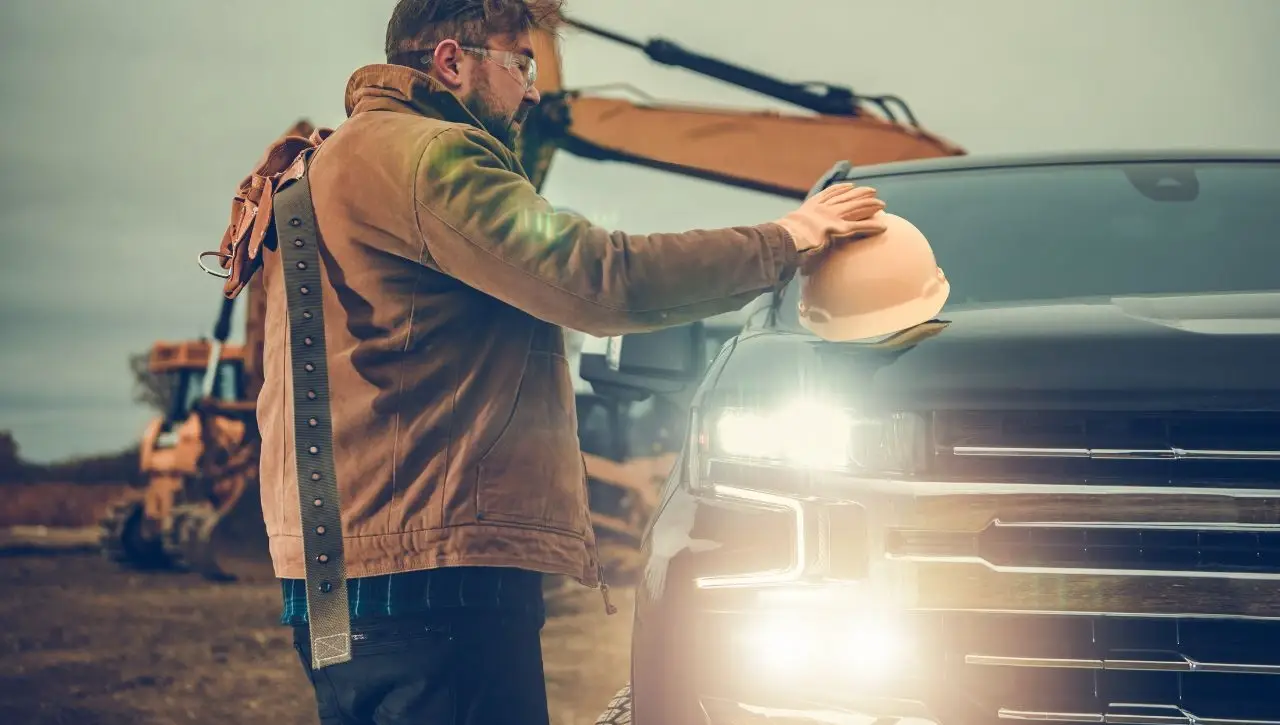 Man with backpack looking at Chevrolet Silverado High Country 1500 powerhouse pickup exploring suitability for Indian roads