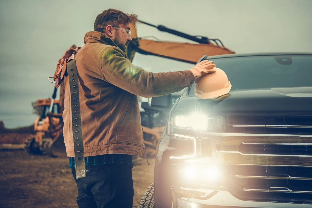 Man with backpack looking at Chevrolet Silverado High Country 1500 powerhouse pickup exploring suitability for Indian roads