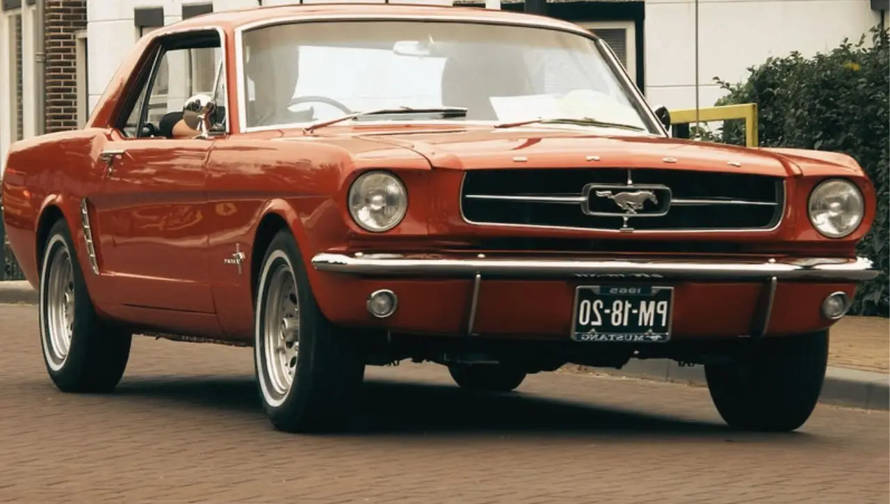 Red vintage Ford Mustang convertible 1965-73 top muscle car and its rising value for collectors dream