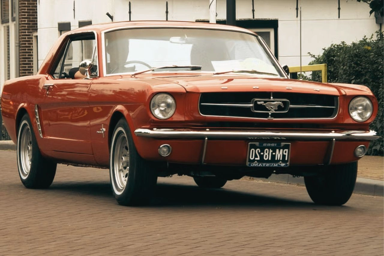 Red vintage Ford Mustang convertible 1965-73 top muscle car and its rising value for collectors dream