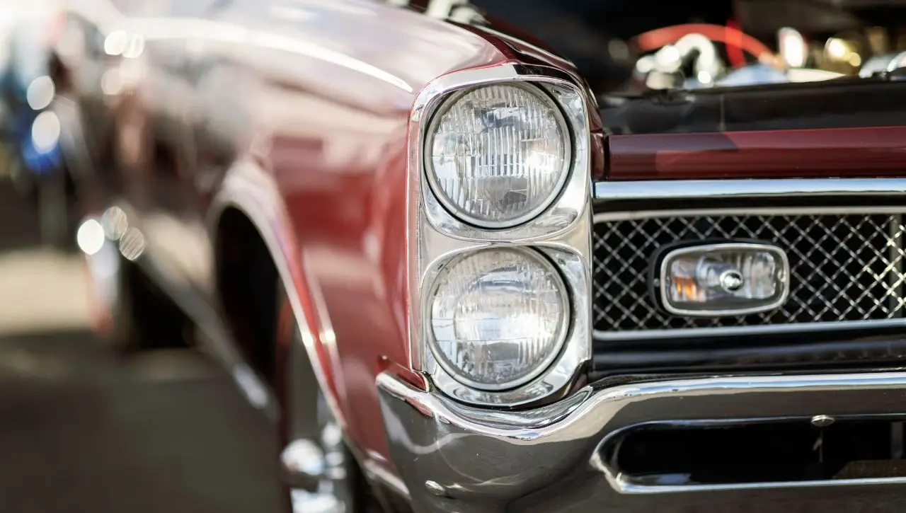 Red Pontiac GTO front grille and headlights close-up buyers guide Americas first muscle car explained for India